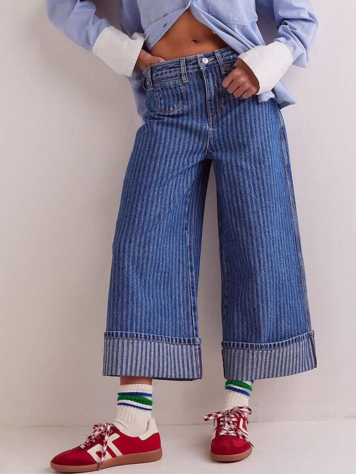 Plush Fashion Hub wide-leg cropped denim jeans with a relaxed fit and classic blue wash, displayed on a hanger.
