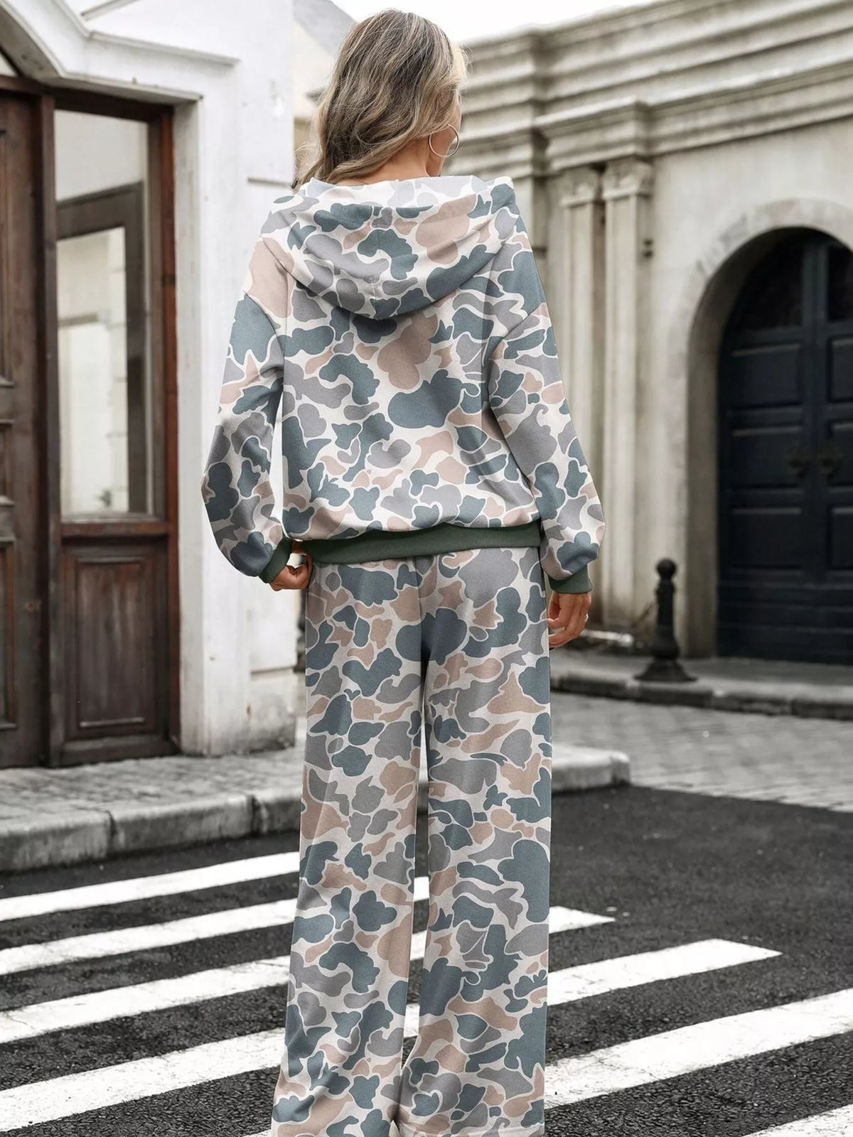 Printed long sleeve hoodie and pants set by Trendsi, featuring a matching casual outfit with vibrant design and comfortable fit.