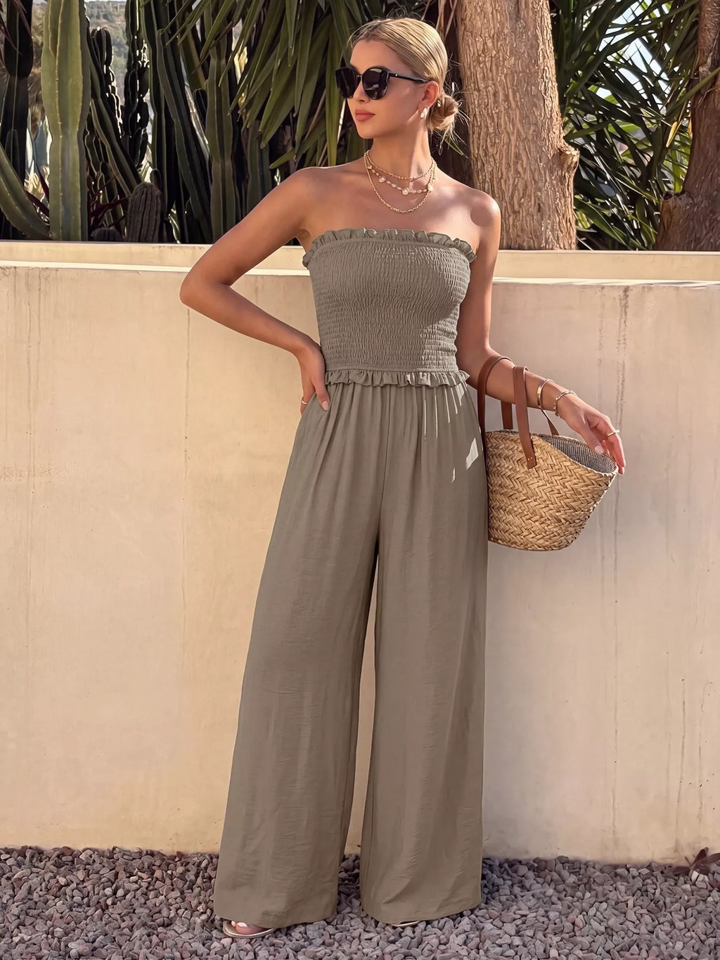 Smocked strapless wide-leg jumpsuit from Trendsi, featuring a relaxed fit and flowy fabric, perfect for casual and summer wear.