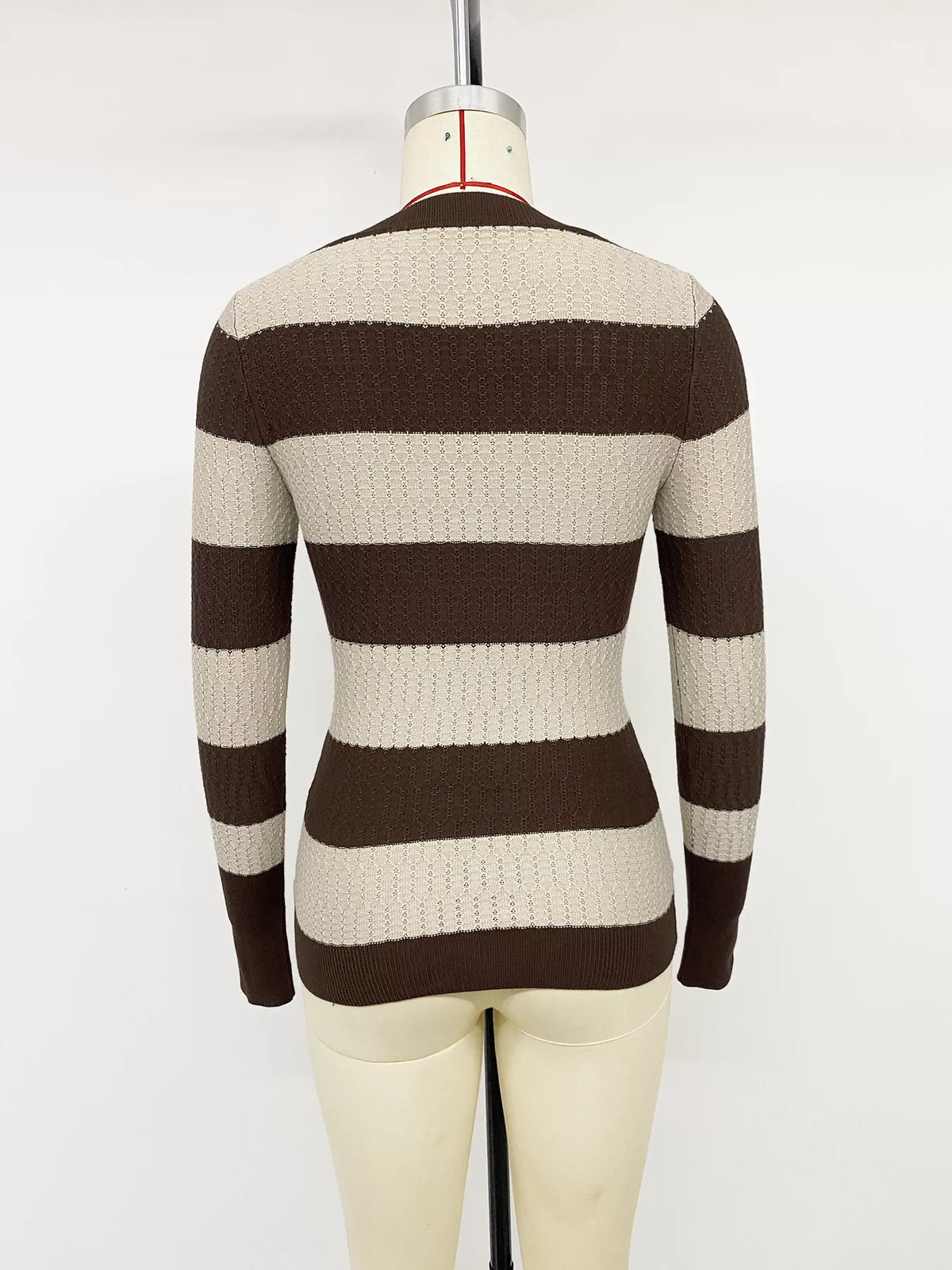 Striped V-neck knit top from Plush Fashion Hub featuring blue and white horizontal stripes and a fitted V-neck design.