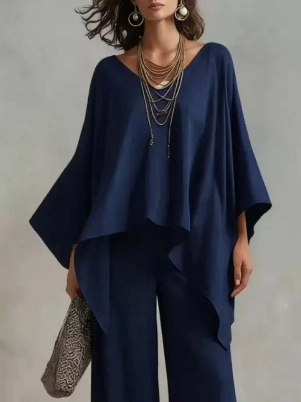 Plus size V-neck loungewear top and pants set by Plush Fashion Hub, comfortable full-size lounge clothing in soft fabric.