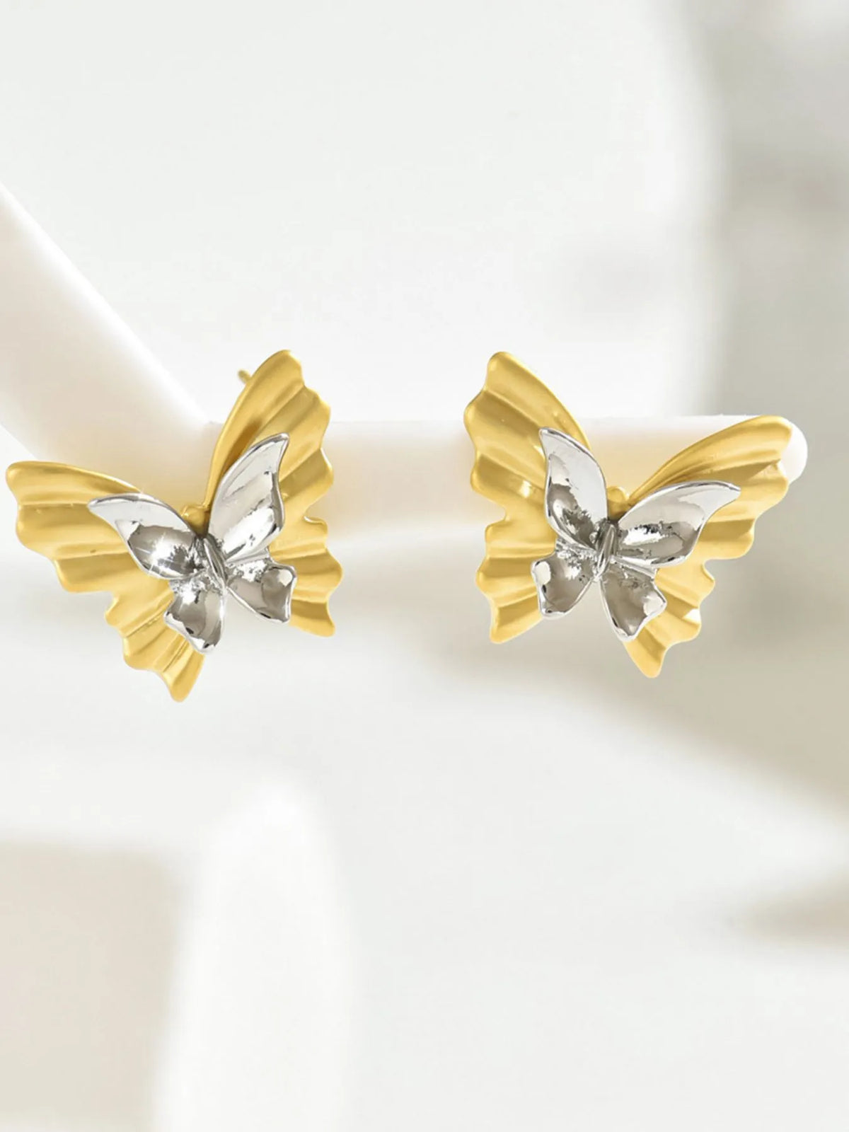 Two-tone stainless steel butterfly earrings from Plush Fashion Hub with intricate butterfly design and polished finish