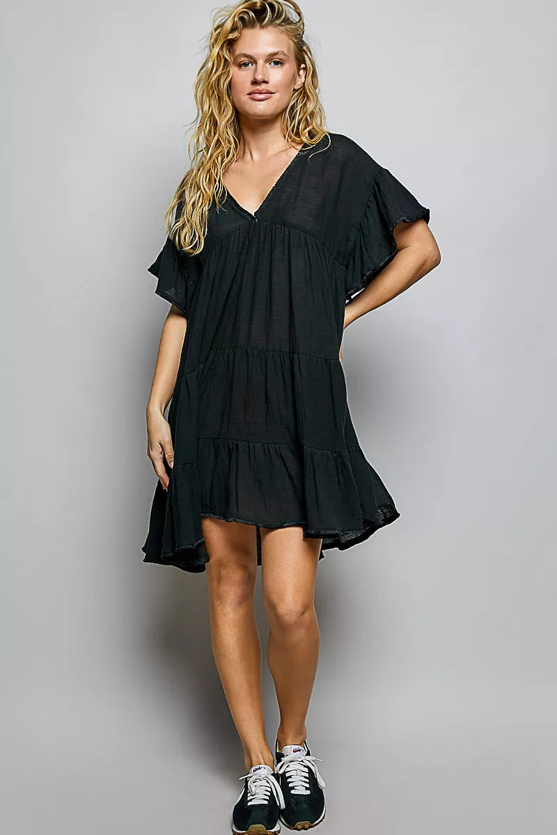Cotton ruffle shirred V-neck short sleeve dress by Plush Fashion Hub, featuring a feminine design with ruffle details and a flattering fit.
