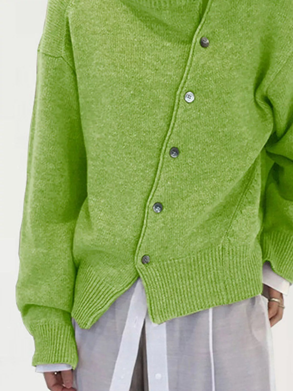 Asymmetric button-down sweater by Trendsi, featuring a stylish design with unique button placement and cozy knit fabric.