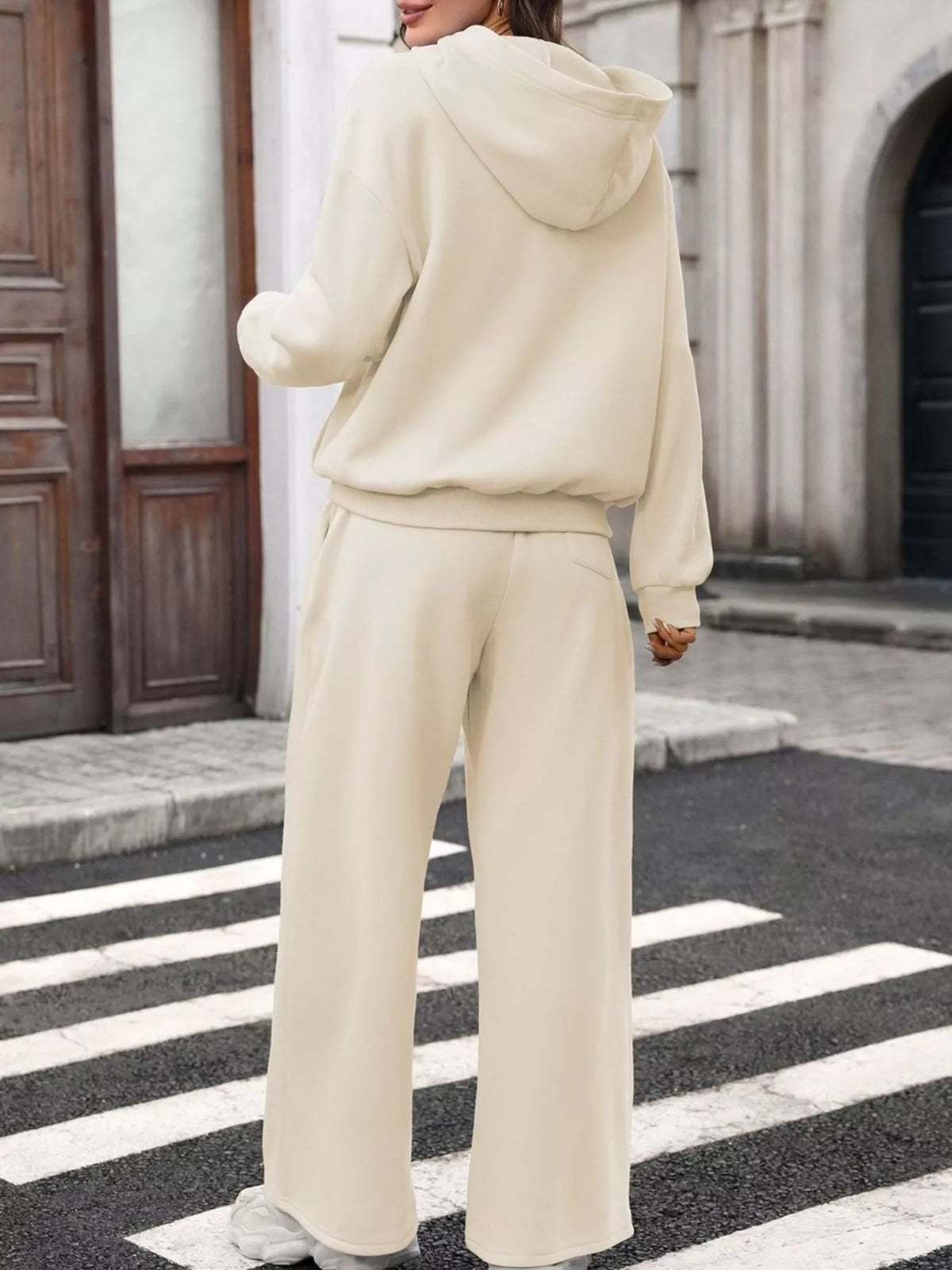 Trendsi women's hoodie and wide-leg pant set featuring a kangaroo pocket hoodie and relaxed-fit pants for comfortable casual wear.
