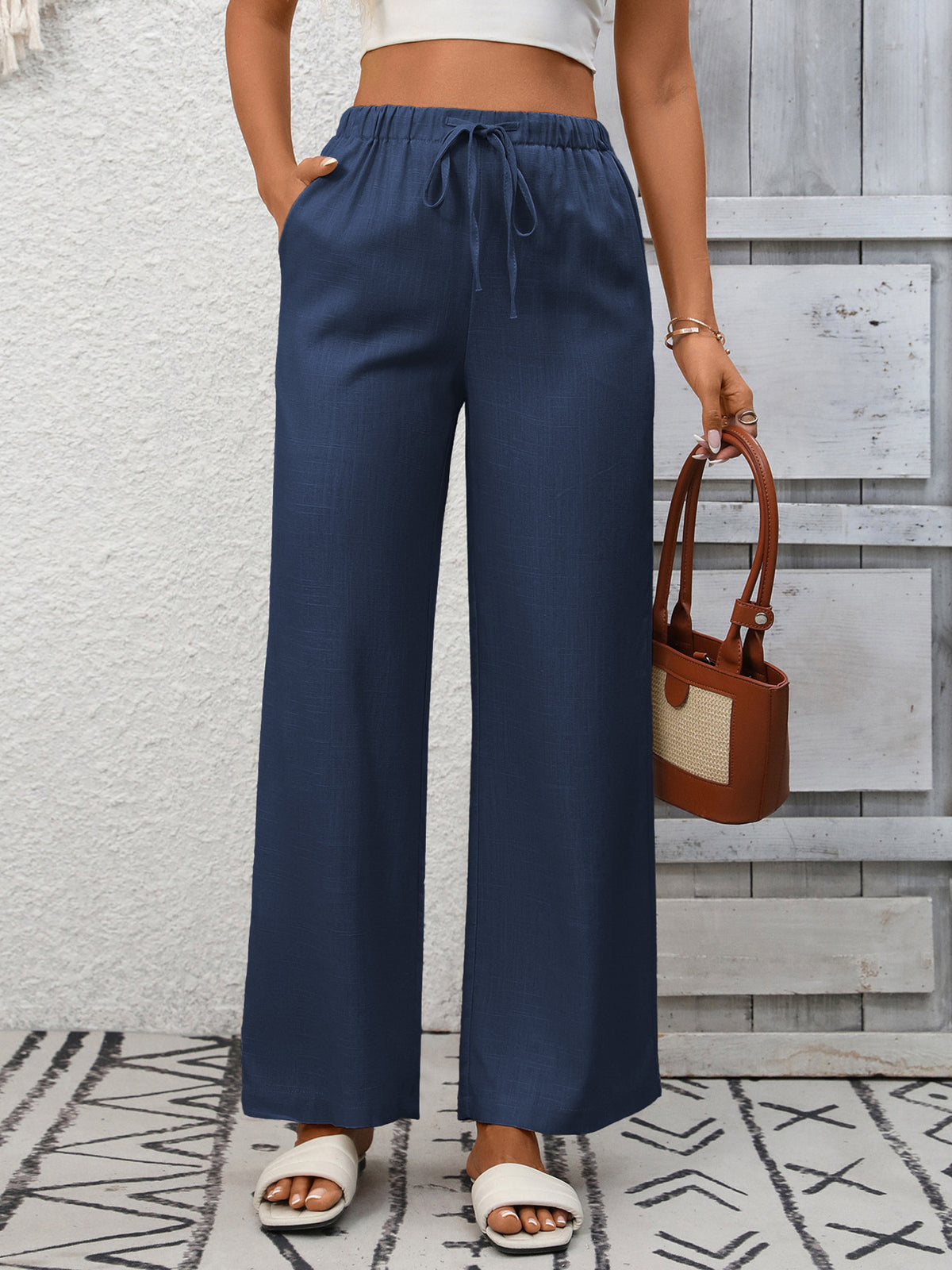 Women’s high-waisted wide-leg drawstring pants in soft breathable viscose, stylish and comfortable for casual wear.
