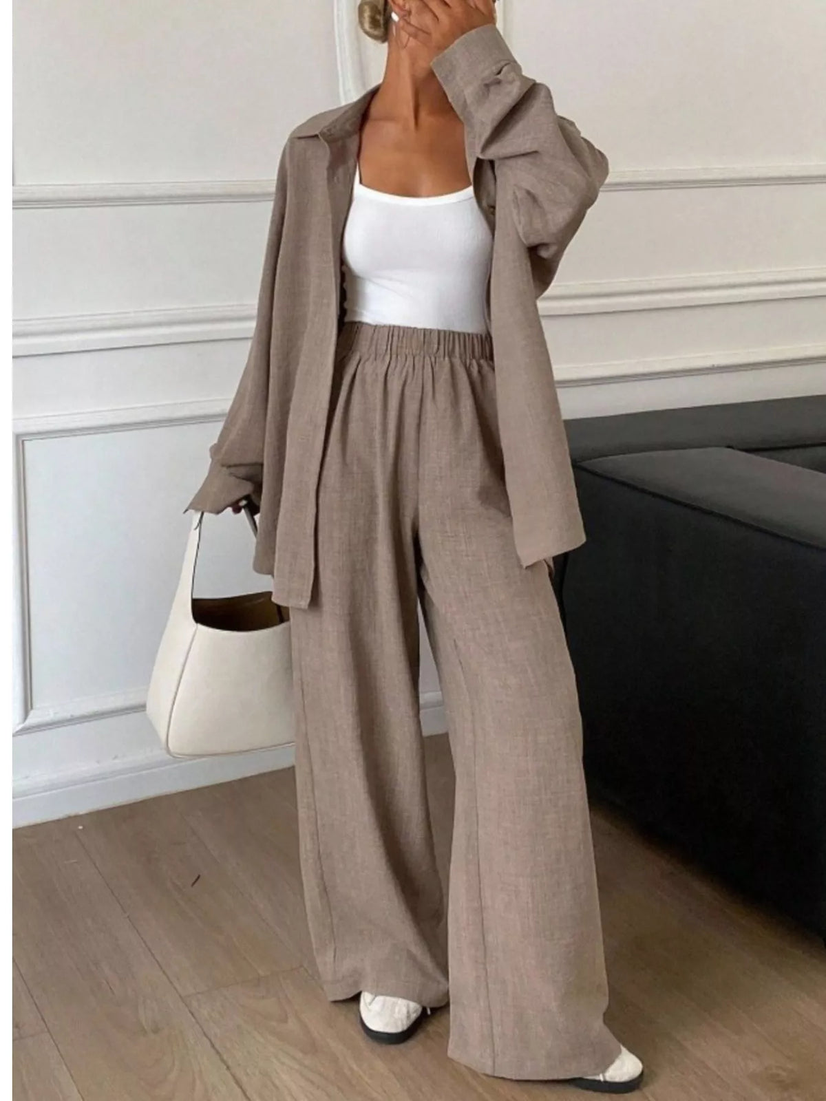 Trendsi long sleeve button-up shirt and wide-leg pants set, stylish and comfortable clothing ensemble for casual or office wear.