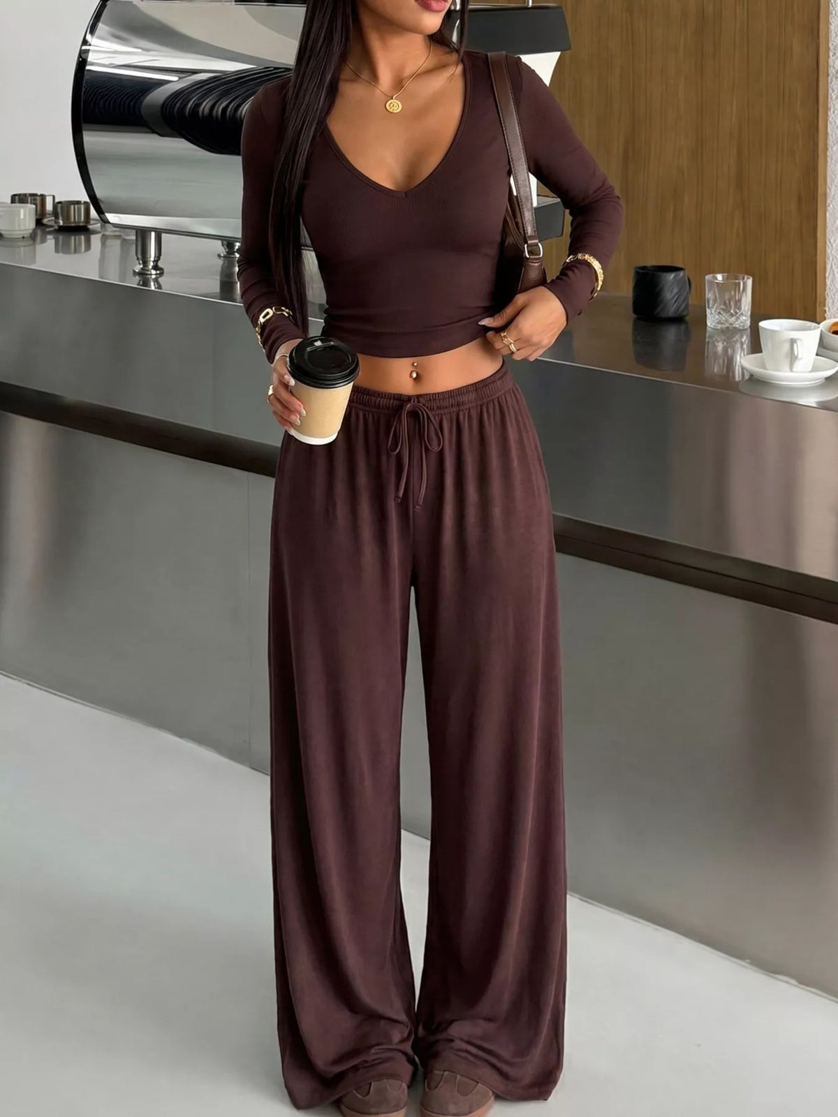 Plush Fashion Hub matching set with V-neck long sleeve top and wide-leg pants, made of plush, soft fabric in a stylish, coordinated look.