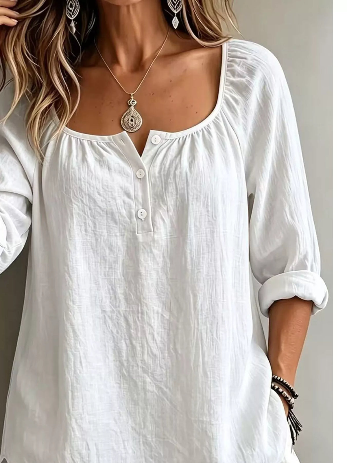 Plush Fashion Hub long sleeve top with button details, soft fabric and stylish design, shown in a close-up image.
