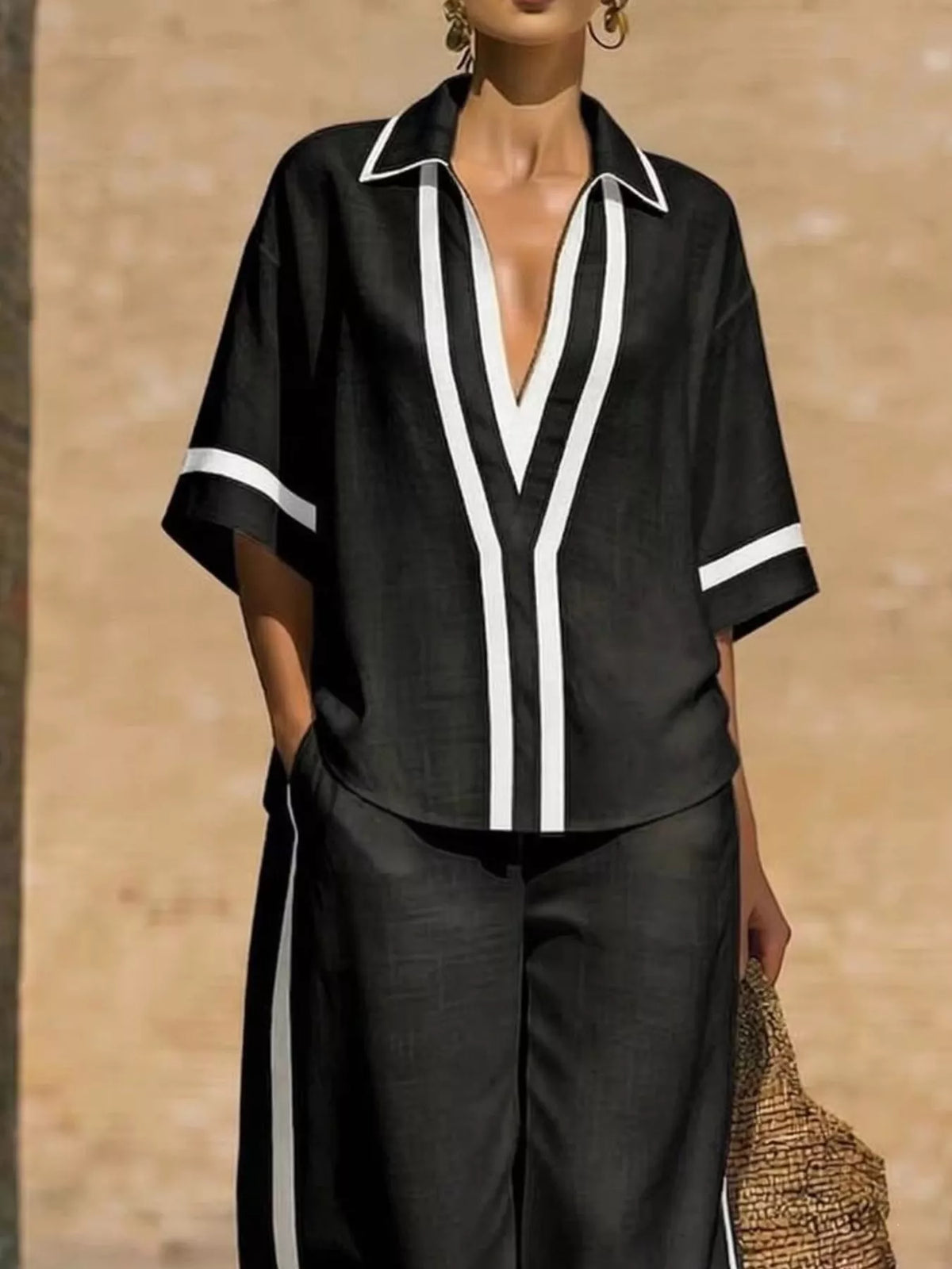Plus size full contrast trim matching top and pants set from Trendsi, featuring a coordinated two-piece outfit with bold trim details.