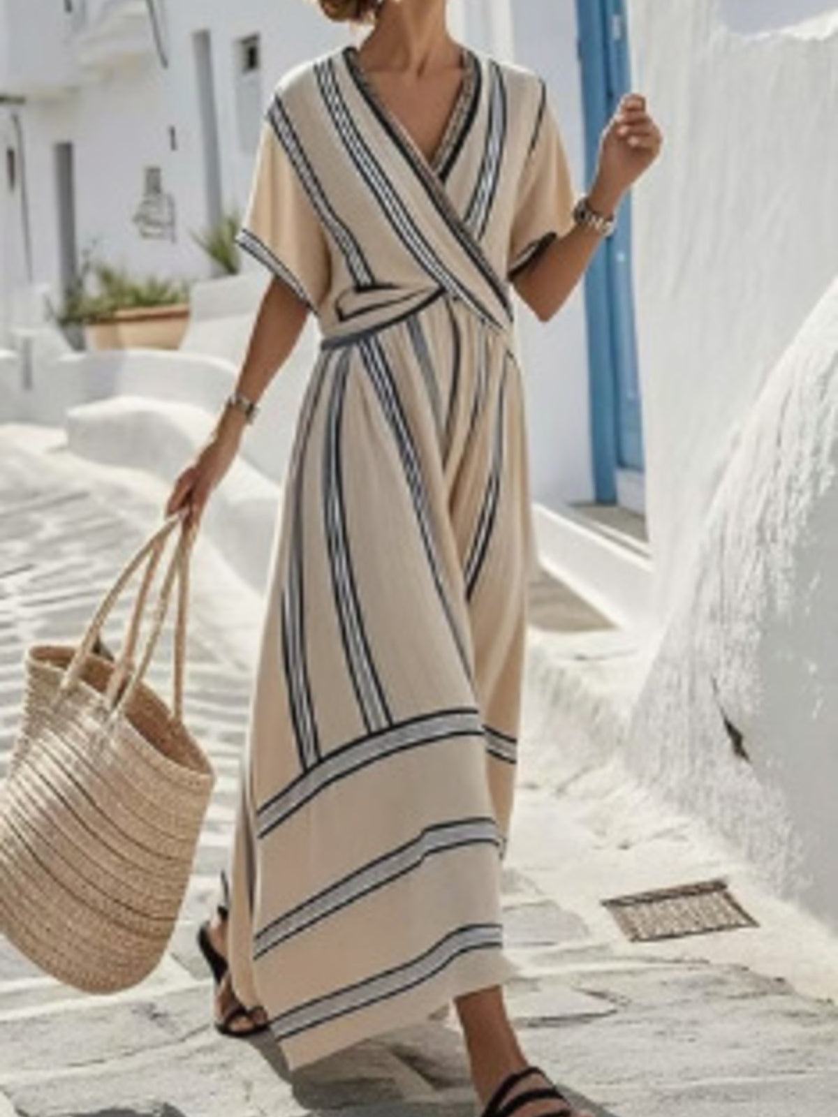 Plus size striped short sleeve wrap maxi dress by Trendsi, featuring a stylish full-length design with a flattering silhouette.