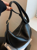 Minimalist crescent-shaped crossbody bag made of smooth PU leather, stylish shoulder purse for everyday use
