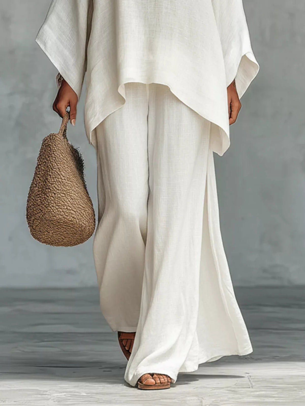 Casual plus size loose fit top and pants set by Trendsi, featuring a comfortable, relaxed two-piece ensemble for everyday wear.