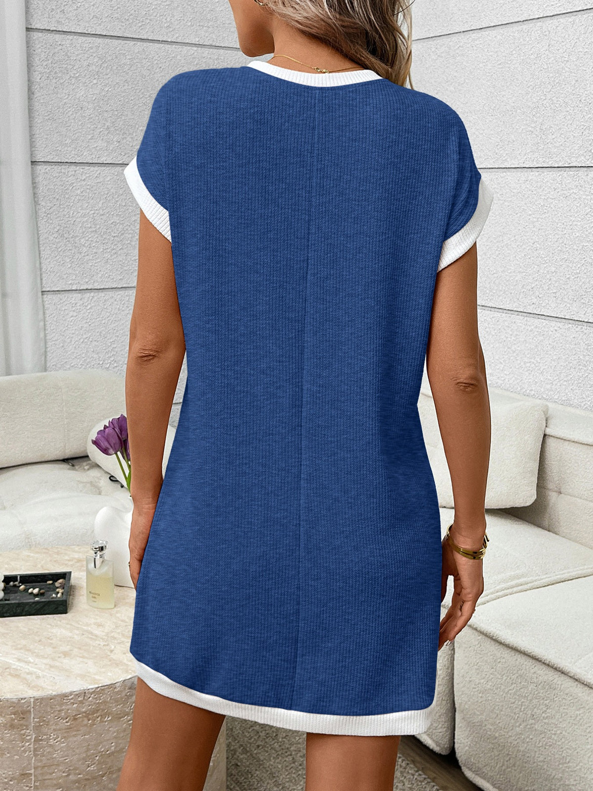 Ribbed knit mini dress with contrast trim and functional pocket in black and white, by Plush Fashion Hub.