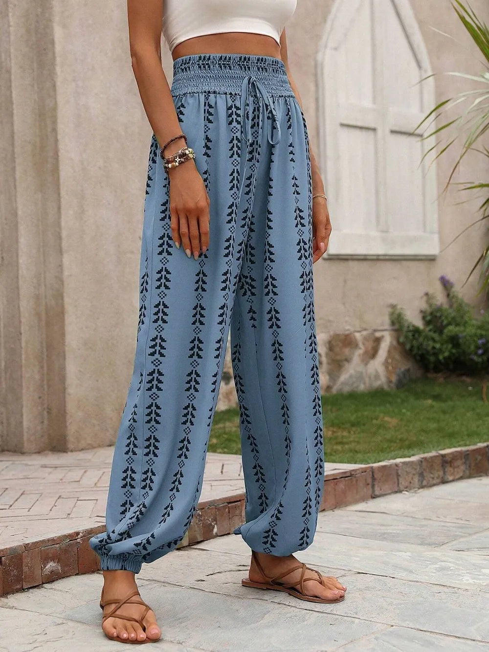 Plush Fashion Hub printed high-waisted pants with a relaxed fit, featuring bold patterns and a comfortable waistband.