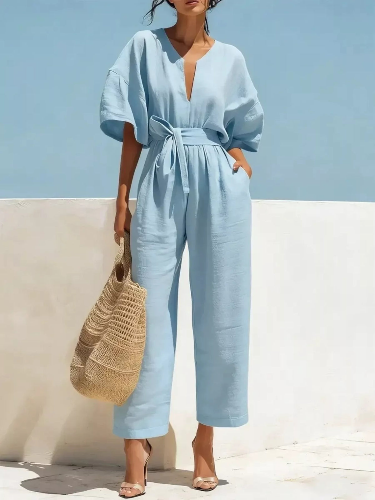 Plush Fashion Hub tie waist wide leg bodysuit with adjustable belt, sleeveless design, and soft fabric for a stylish, comfortable look.