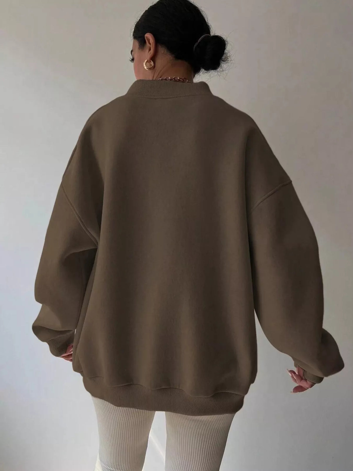 Dropped shoulder long sleeve oversized sweatshirt by Trendsi, featuring a relaxed fit and cozy fabric in a casual style.