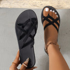 Black FitiqueFit flat strappy cross-strap beach sandals with minimalist design and comfortable flat sole.