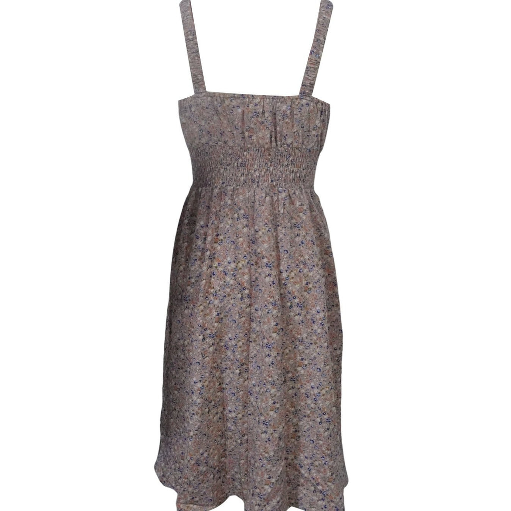 Floral backless A-line dress for women by FitiqueFit, featuring a casual style with a flowy silhouette and vibrant floral pattern.