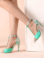 Floral print T-strap high heel sandals in premium PU leather with ankle buckle and open toe design.