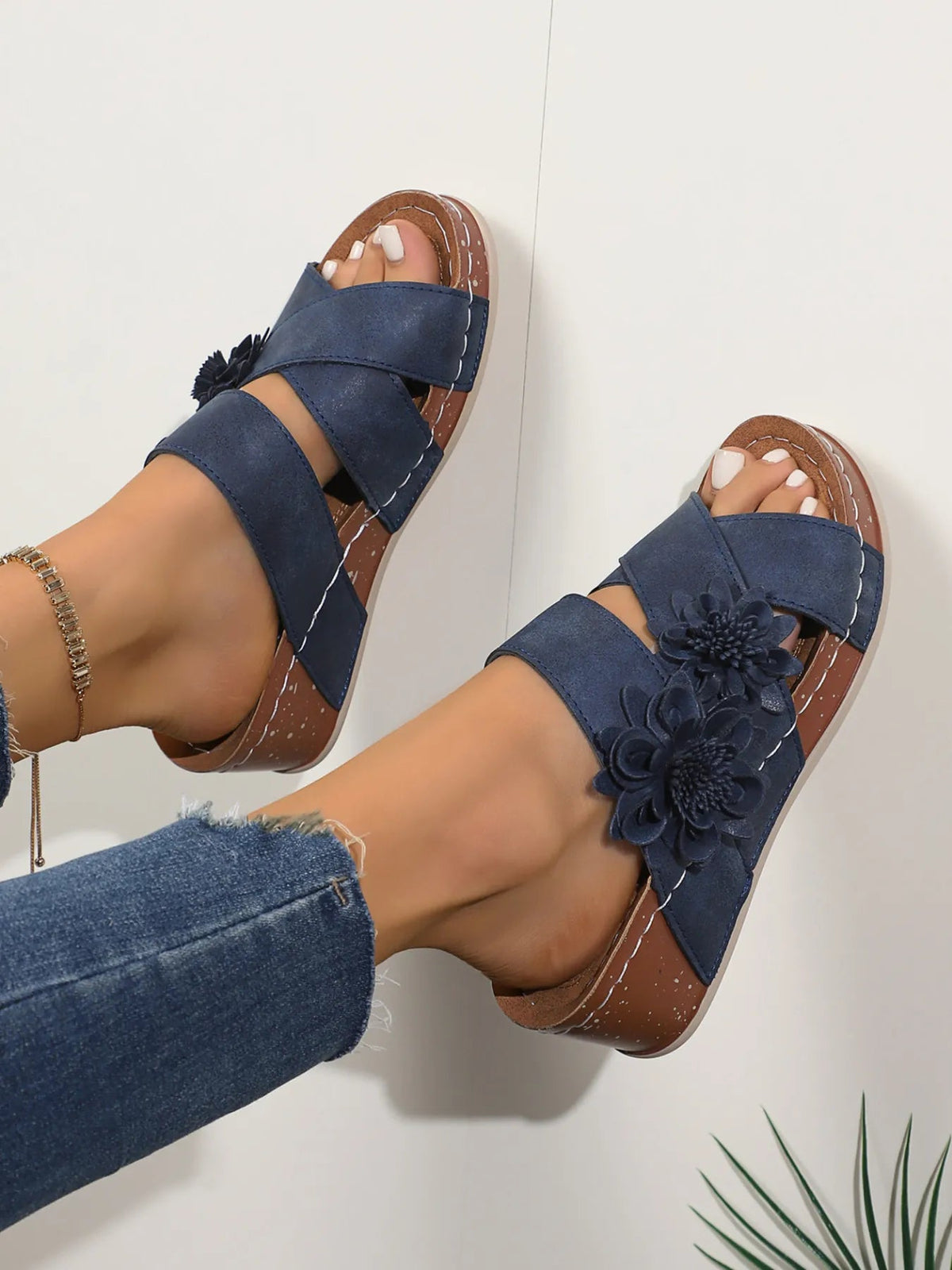 Women's floral crisscross wedge sandals by Plush Fashion Hub featuring colorful flower patterns and comfortable wedge heels.