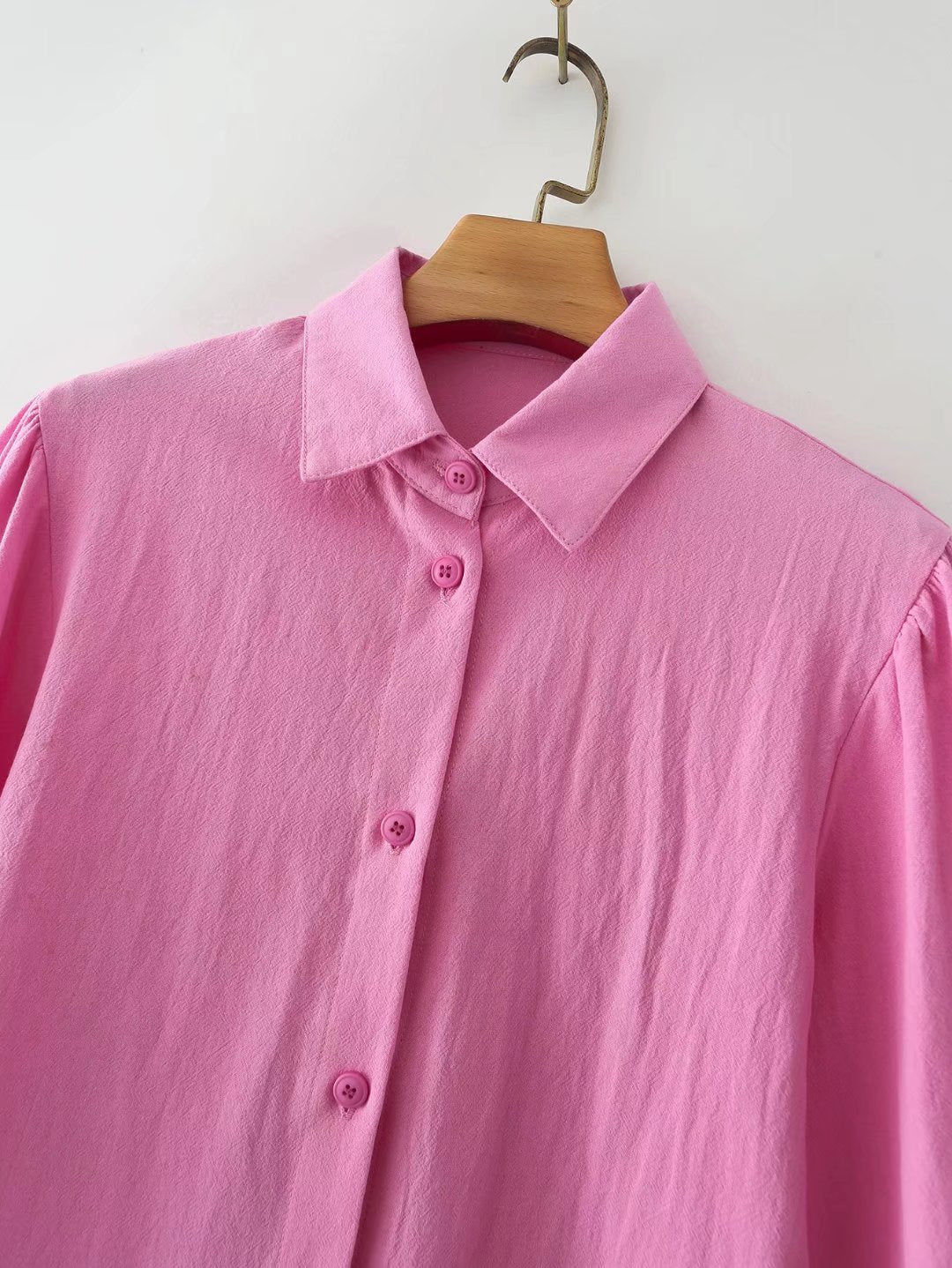 Plush Fashion Hub women's cotton long-sleeved shirt with polo collar, solid color, single-breasted, lantern sleeves.
