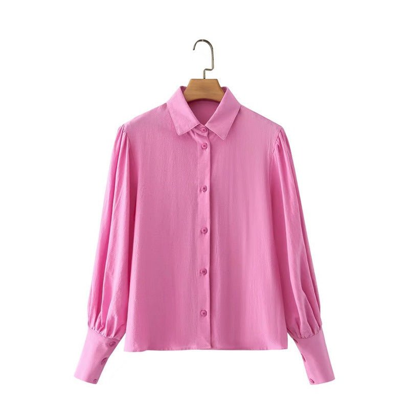 Women’s white cotton long-sleeved shirt with polo collar, single-breasted design, lantern sleeves, from Plush Fashion Hub.