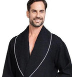 Front view of Lotus Linen men's premium waffle piping robe in small black with piping details, showcasing the soft, textured fabric.