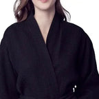 Lightweight black women's waffle robe from Lotus Linen with front view, quick-dry spa comfort and soft, breathable fabric.
