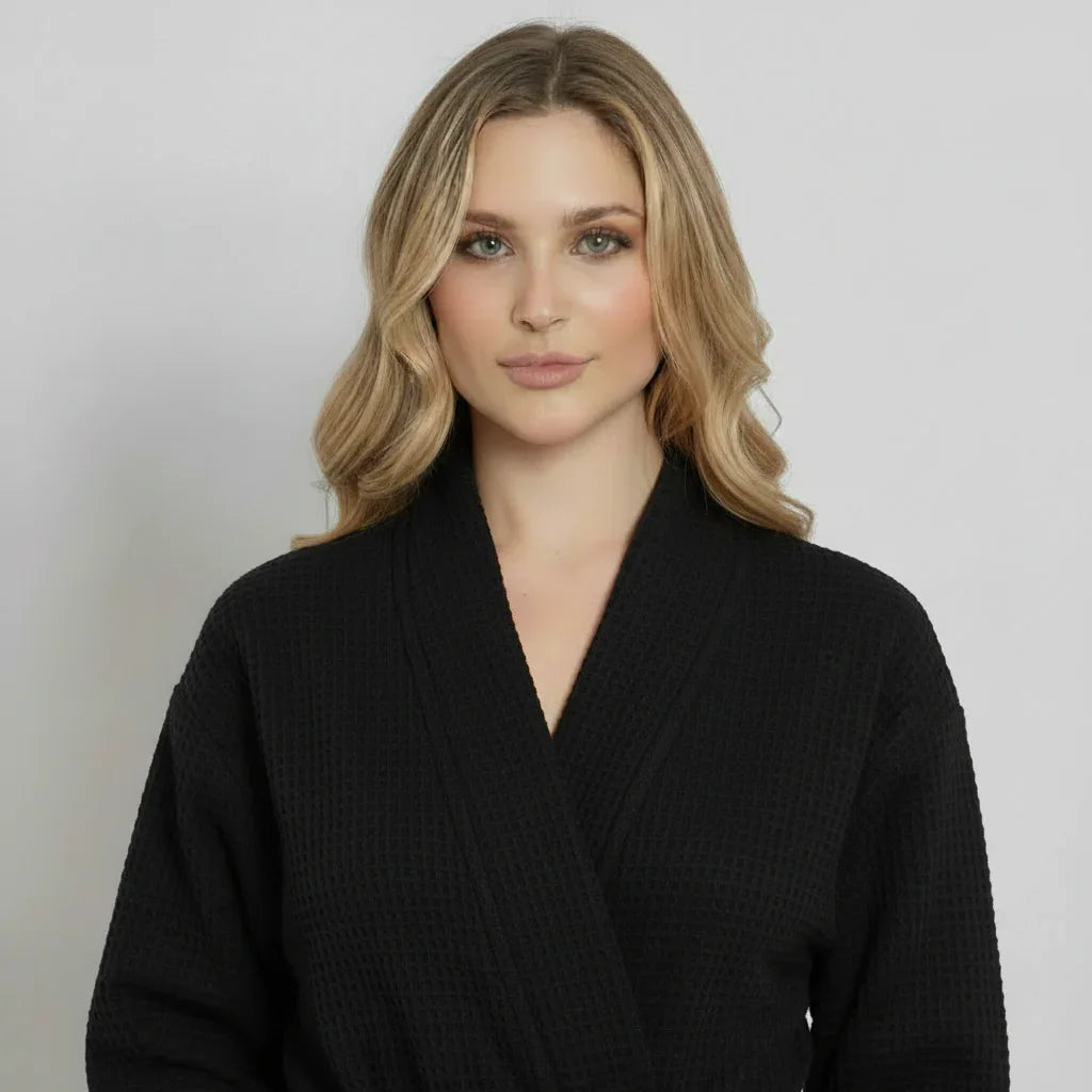 Black lightweight Lotus Linen women's waffle robe with front design, quick-dry spa comfort, perfect for lounging and relaxation.
