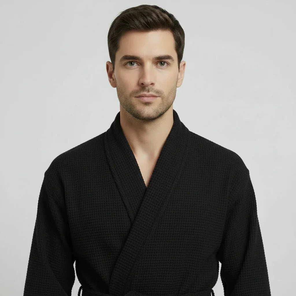 Front view of Lotus Linen men's waffle spa bathrobe in small black, lightweight and absorbent for comfortable lounging.