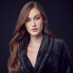Women's soft plush bathrobe by Lotus Linen, front view in small black color, showcasing cozy, lightweight robe with a tie waist.