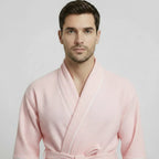 Front view of Lotus Linen men's premium waffle piping robe in blush with white piping, lightweight and cozy for home wear.
