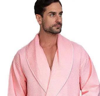 Front view of Lotus Linen men's premium waffle piping robe in blush with piping details, showcasing its cozy design.