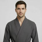 Front view of Lotus Linen men's waffle spa bathrobe in charcoal, lightweight and absorbent for comfortable relaxation.