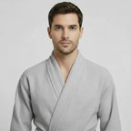 Front view of Lotus Linen men's waffle spa bathrobe in small grey, lightweight and absorbent for comfortable wear.