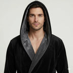 Men's black and gray plush hooded robe from Lotus Linen, showing the front with a small hood and soft, cozy fabric.
