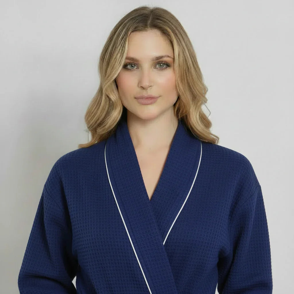 Women’s navy waffle piping bathrobe by Lotus Linen, lightweight spa-style robe with front design and piping details.
