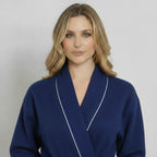 Women’s navy waffle piping bathrobe by Lotus Linen, lightweight spa-style robe with front design and piping details.