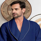 Front view of Lotus Linen men's navy waffle piping robe with a small piping detail, showcasing its soft, textured fabric.