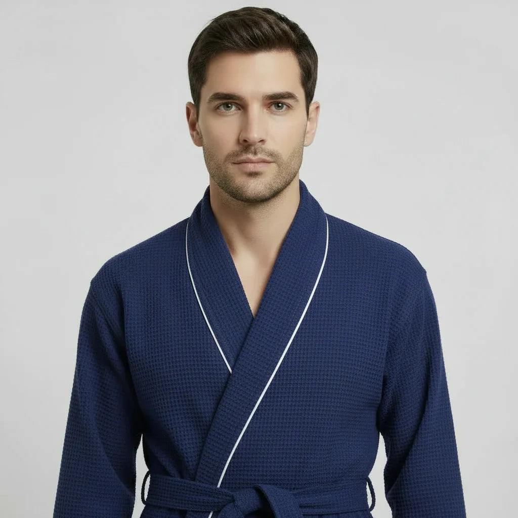 Front view of Lotus Linen men's navy waffle piping robe, showcasing the small piping details and comfortable robe fit.