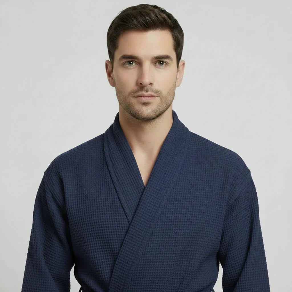 Front view of Lotus Linen men's navy waffle spa bathrobe, lightweight and absorbent, showcasing soft fabric and relaxed fit.