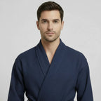 Front view of Lotus Linen men's navy waffle spa bathrobe, lightweight and absorbent, showcasing soft fabric and relaxed fit.