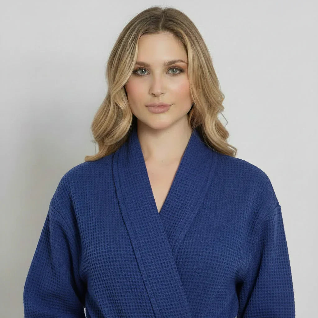 Front view of Lotus Linen women's navy knee-length waffle robe with long sleeves and a tie belt.