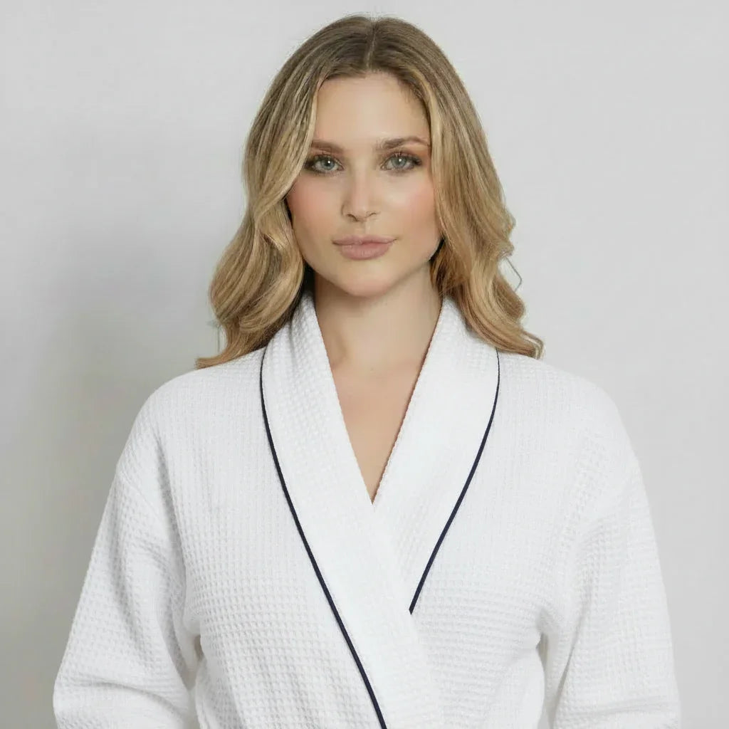Lightweight white women's waffle piping bathrobe by Lotus Linen, front view showing spa-style comfort and small piping details.
