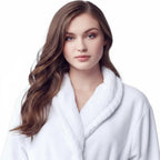 Women's ultra-soft plush bathrobe by Lotus Linen, front view showing cozy white robe with a tie waist and plush fabric.