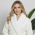 Women’s ultra-soft plush bathrobe by Lotus Linen, front view in small white with cozy, plush fabric and relaxed fit.