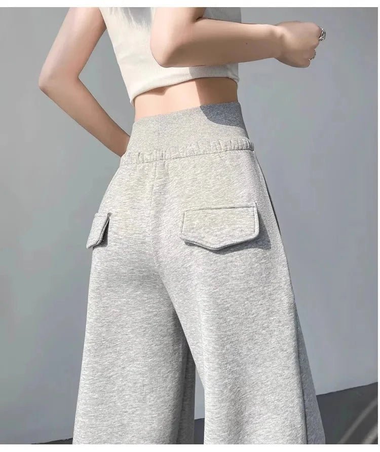Gray high-waist loose wide-leg straight pants for women, casualwear by Plush Fashion Hub, shown on a model.