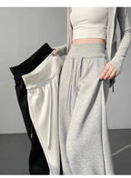 Gray high-waist loose wide-leg straight pants for women, casualwear by Plush Fashion Hub, shown on a model.
