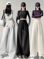 Gray high-waist loose wide-leg straight pants for women, casualwear by Plush Fashion Hub, displayed on a model.